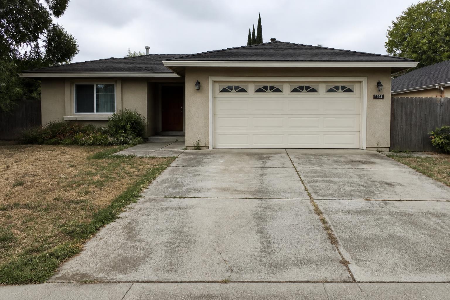 Old cracked asphalt driveway